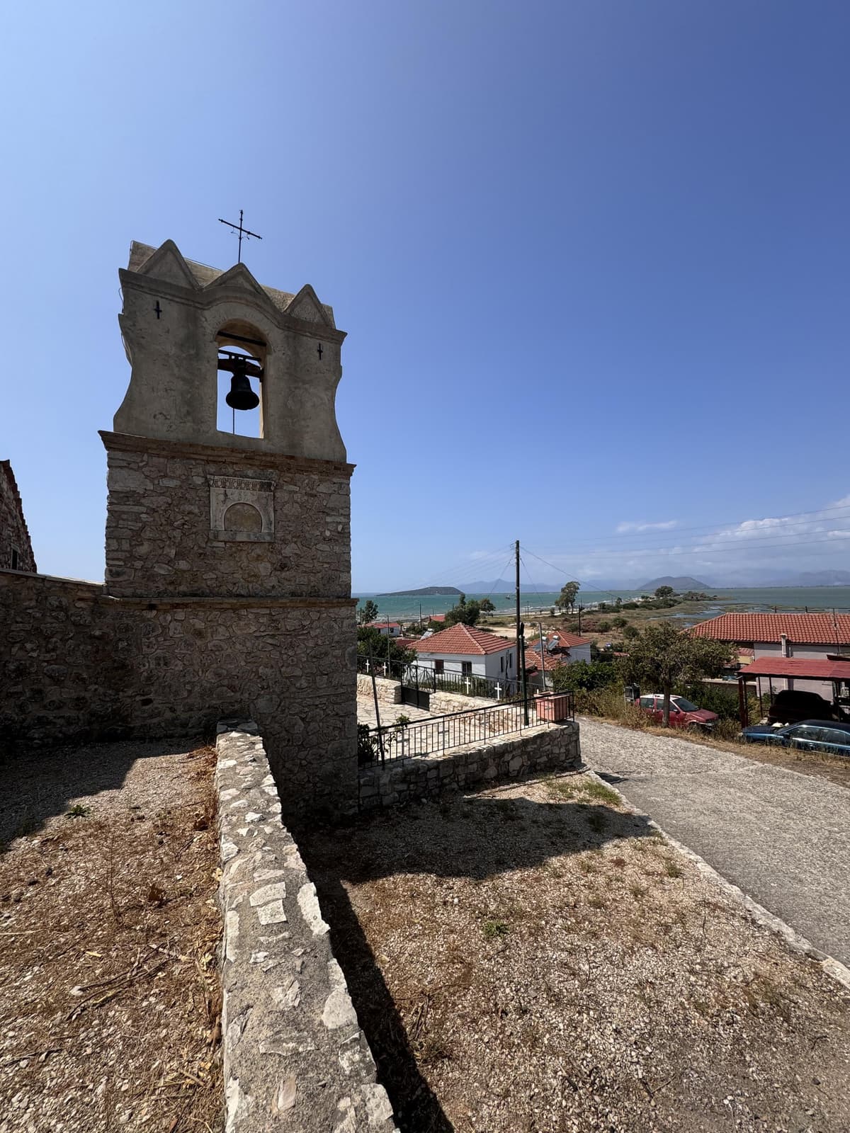Stone bell tower view over Koronisia landscape